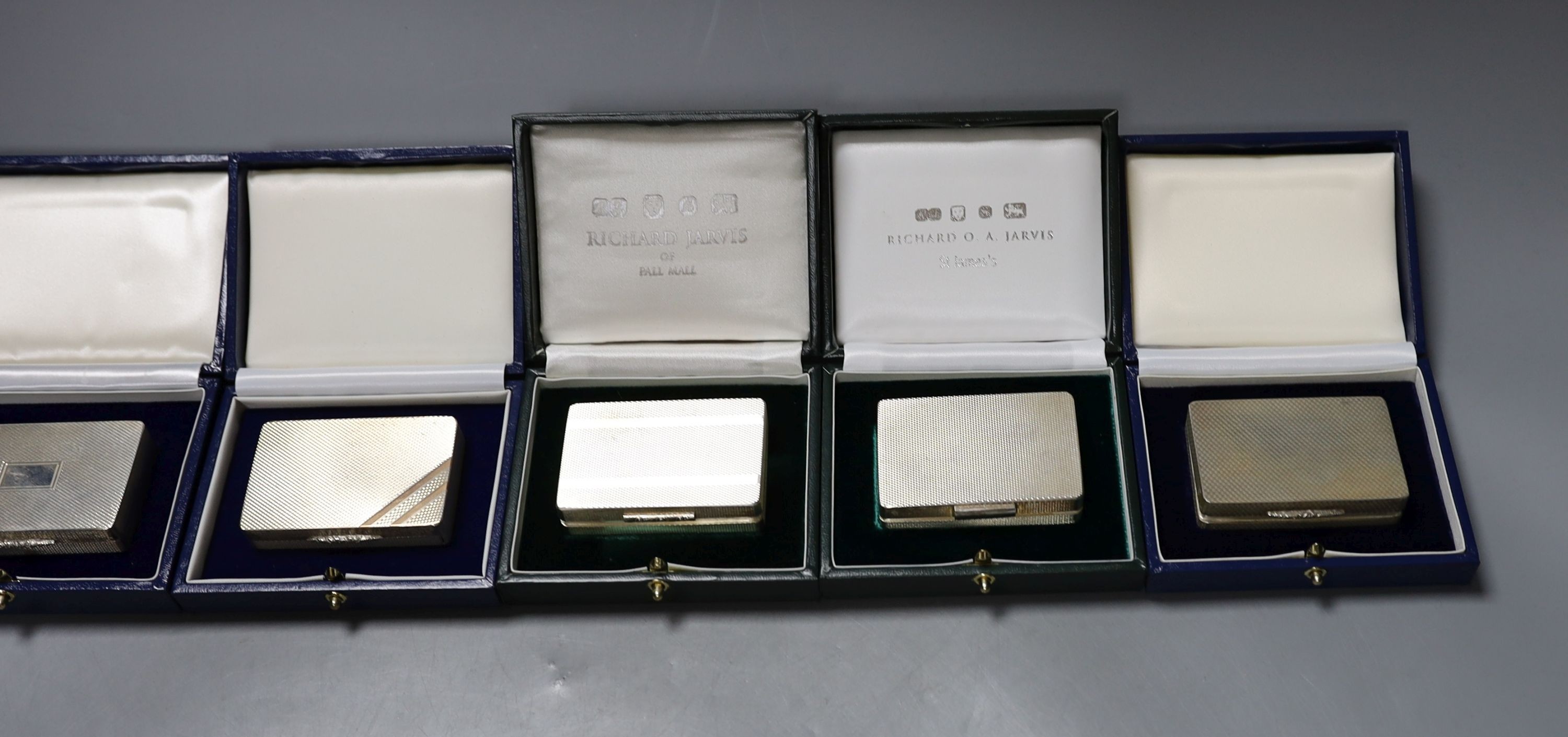 Six assorted modern cased silver or parcel gilt silver pill boxes, by Peter John Doherty, London, 2000-2005 and one Edinburgh, largest 65mm, all in fitted Gallagher boxes.